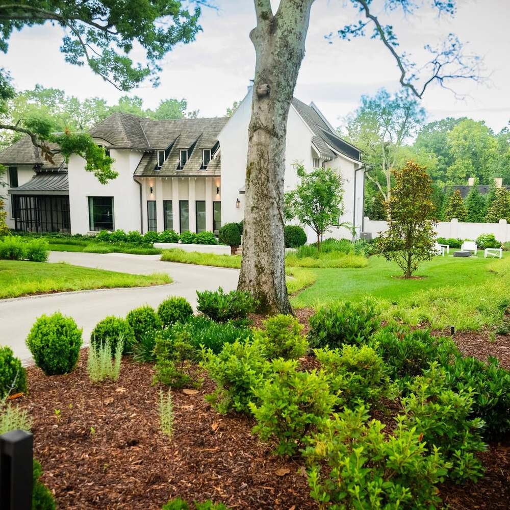 Well-maintained yard and large house Well-maintained yard and large house