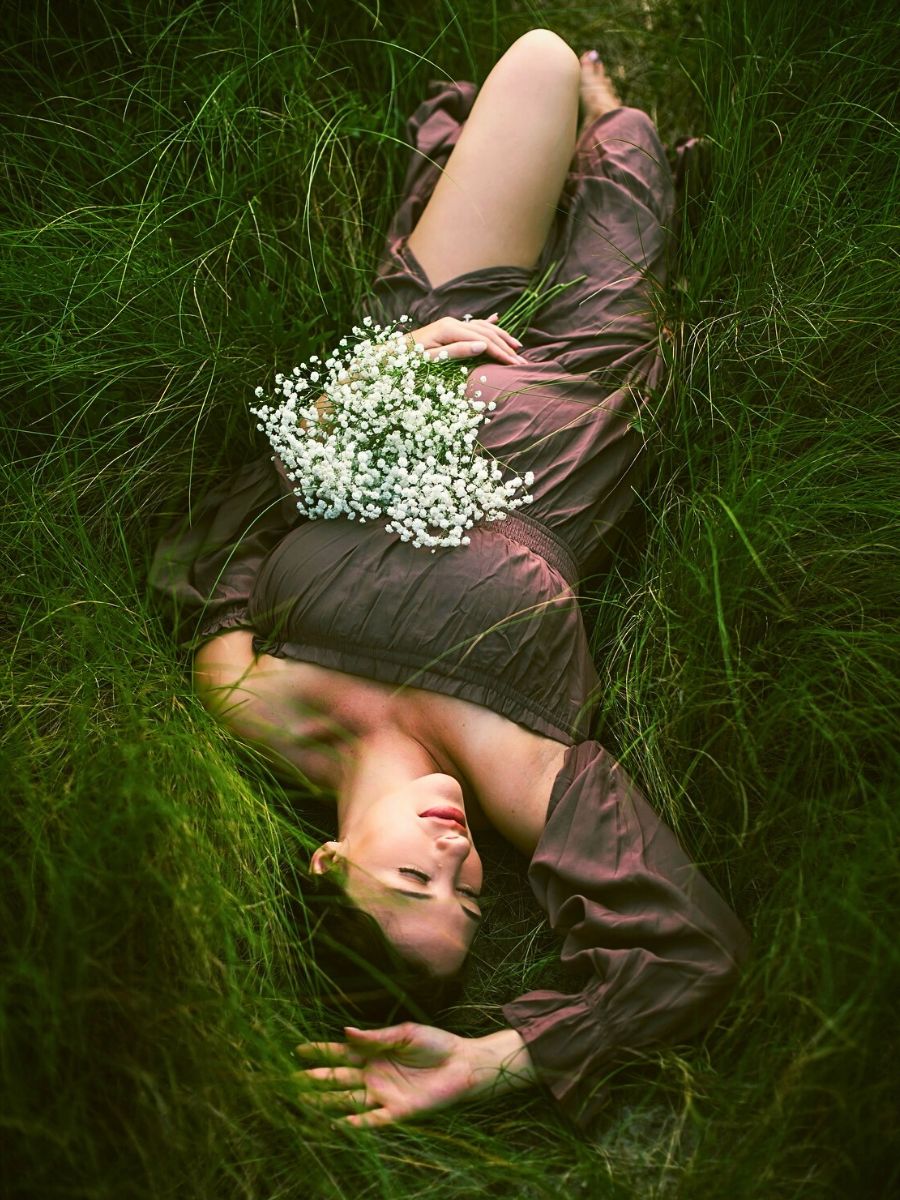 On a grassy patch with flowers Humans Are Losing Their Bond With Nature, but the Connection Can Be Restored - Thursd Article