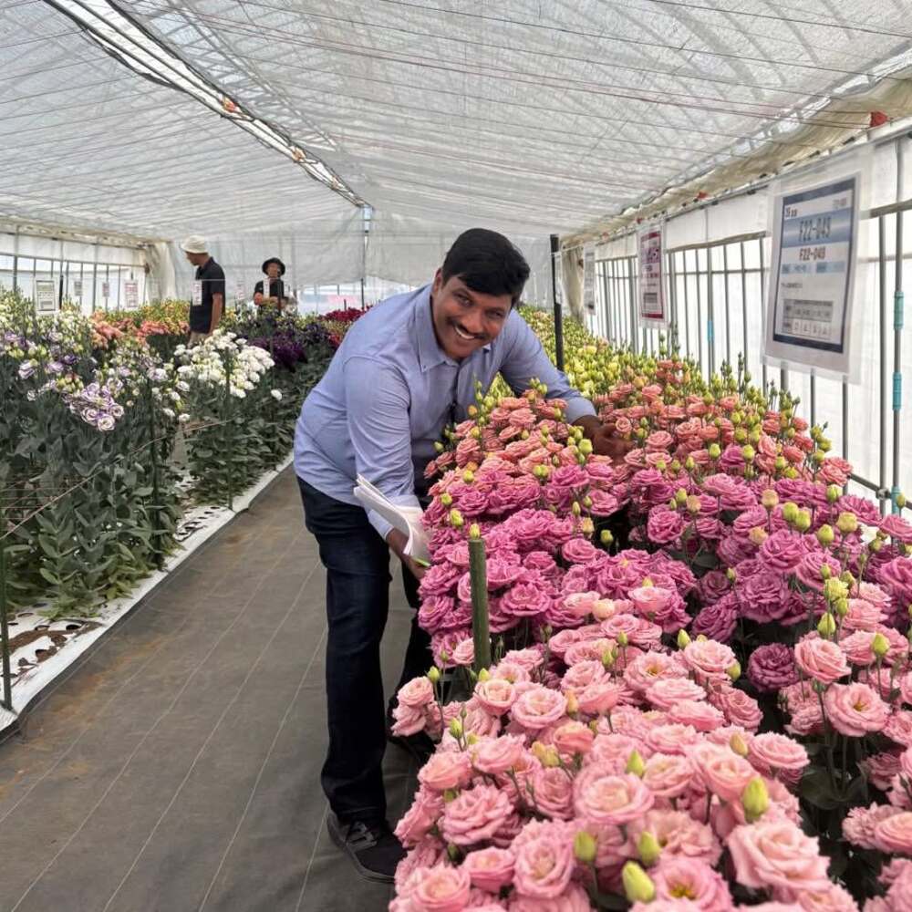 Srikanth bollapally with flowers at a farm