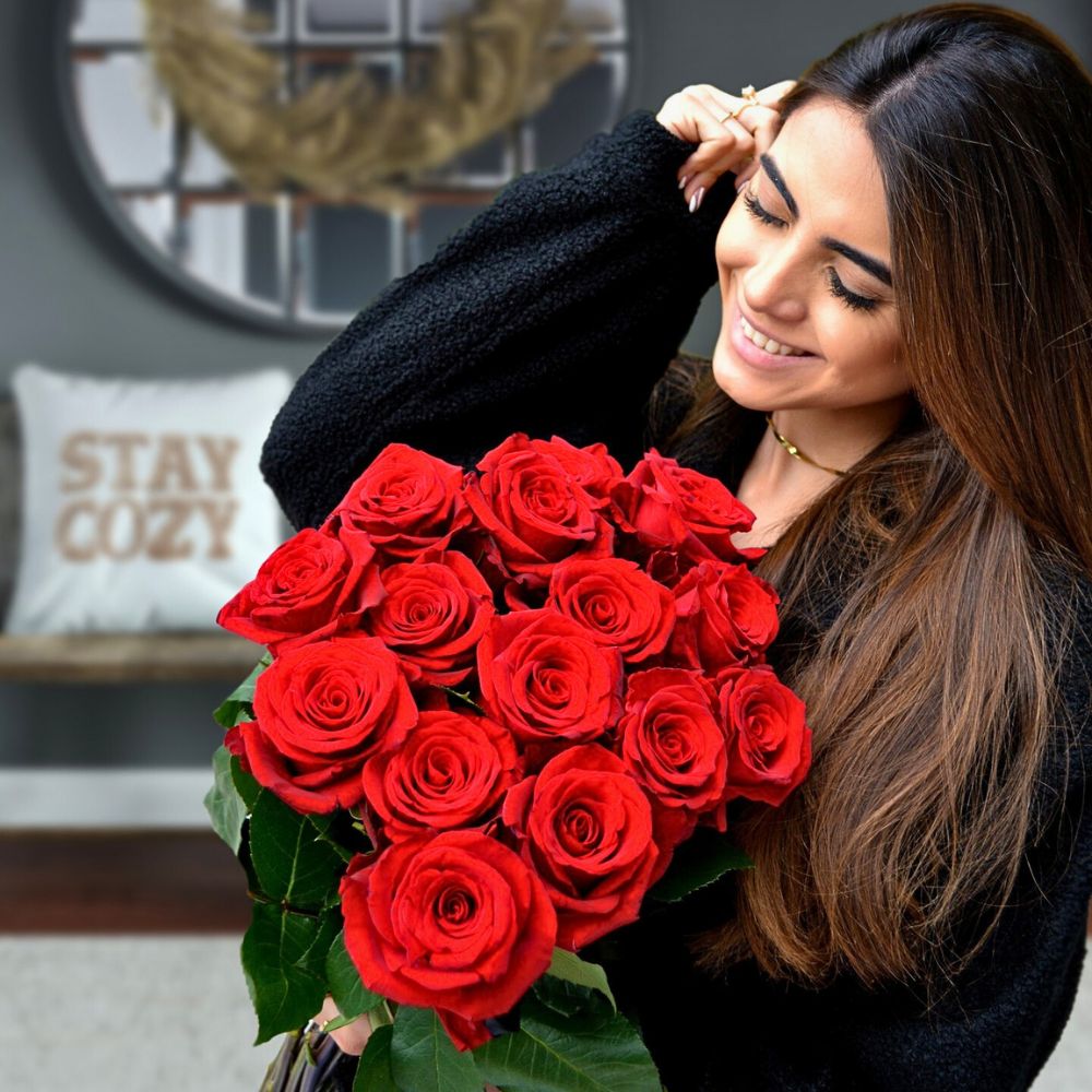 Admiring red roses The Many Positive Aspects of Plants and Flowers Mean We Should Pay More Attention to Them.