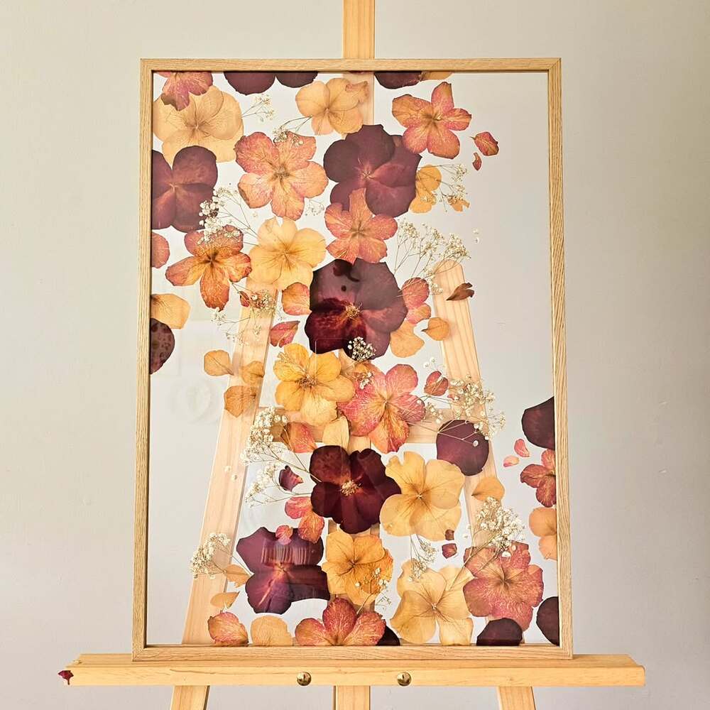 Dried flowers framed on easel Dried flowers framed on easel