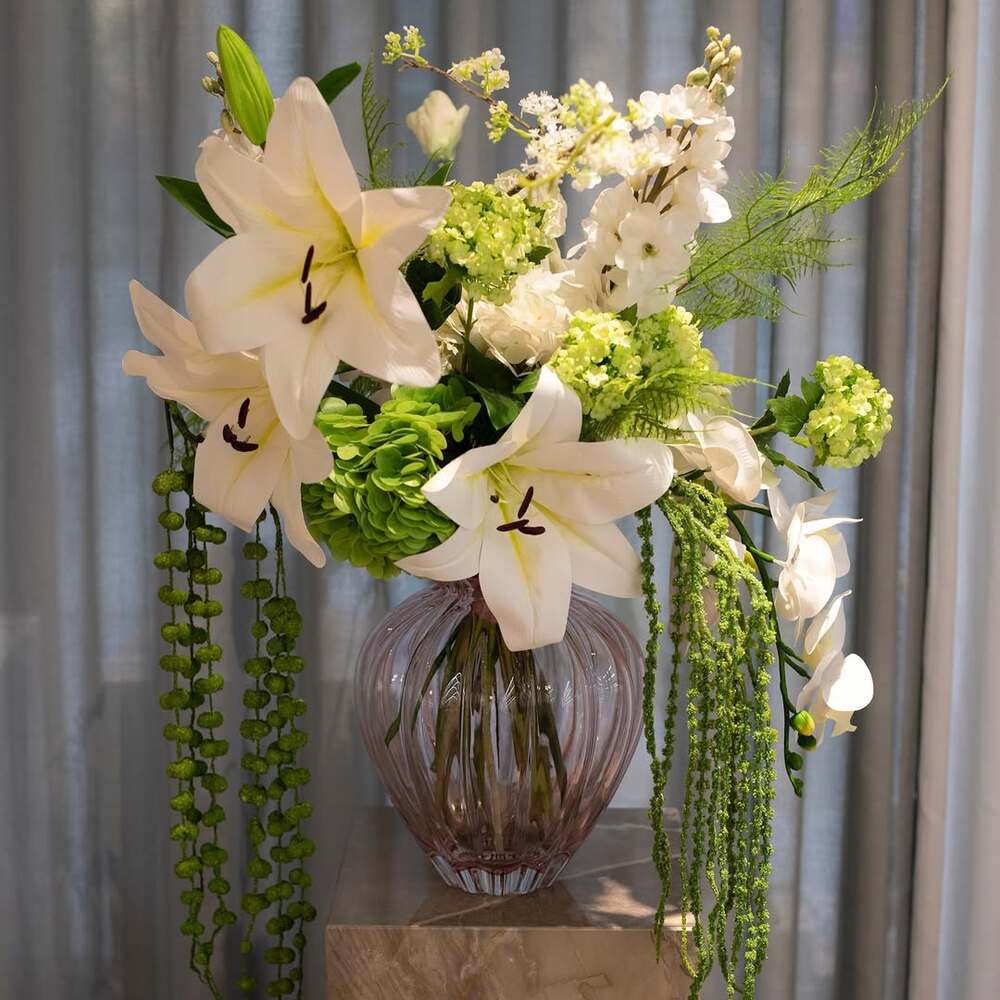 White lily floral arrangement in vase White lily floral arrangement in vase