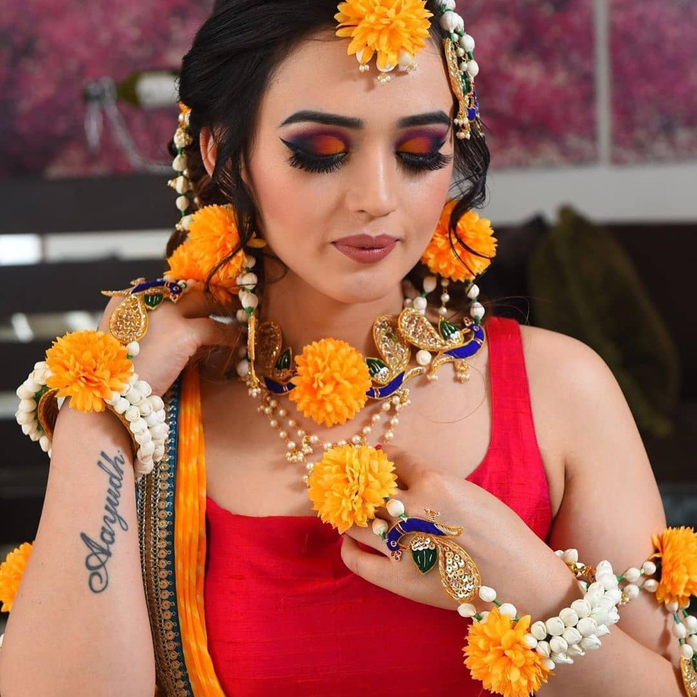 Woman in marigold floral jewelry Woman in marigold floral jewelry