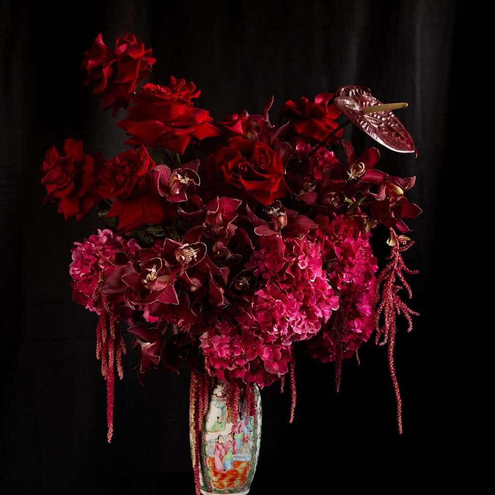 Red and burgundy flowers in vase Red and burgundy flowers in vase