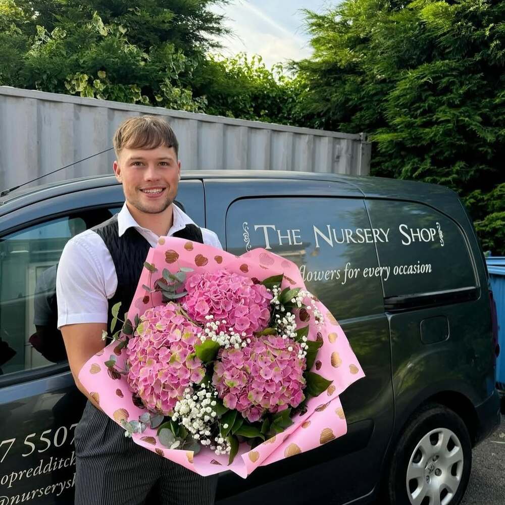 Florist with pink hydrangea bouquet Florist with pink hydrangea bouquet