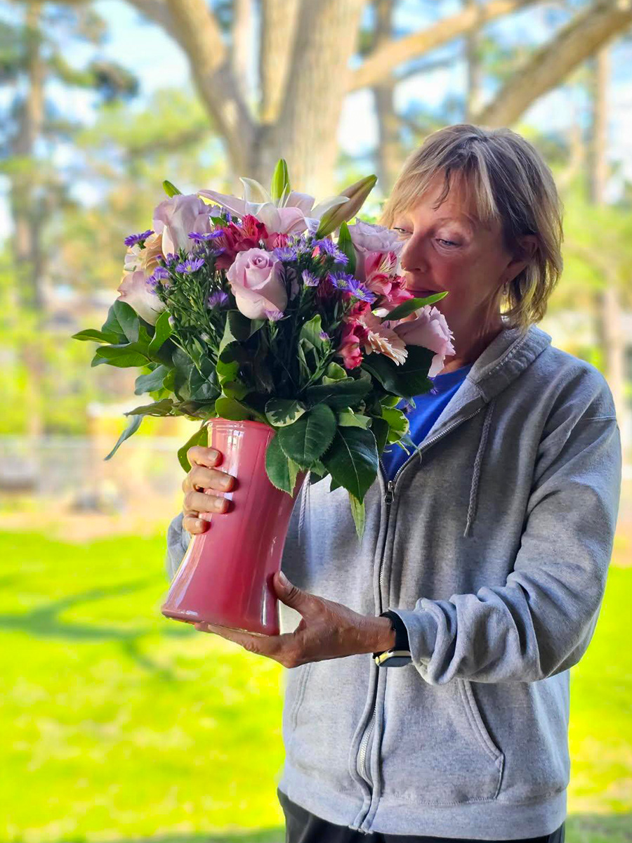 Peter Ault blog woman looking at flower vase