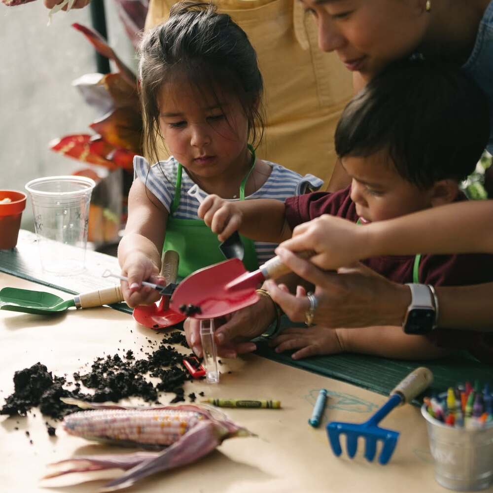 Kids playing with garden soil Kids playing with garden soil