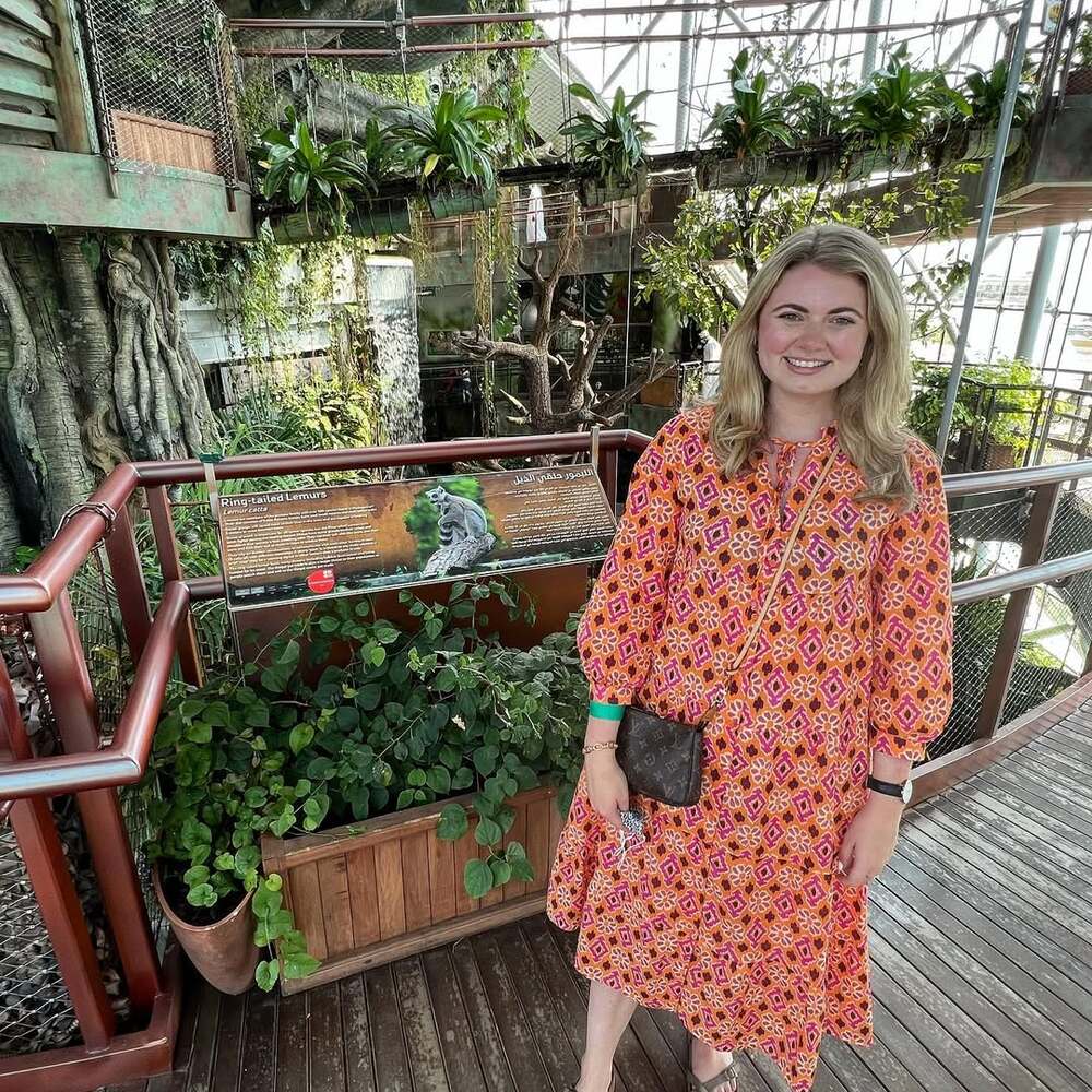 Woman stands among jungle plants Woman stands among jungle plants