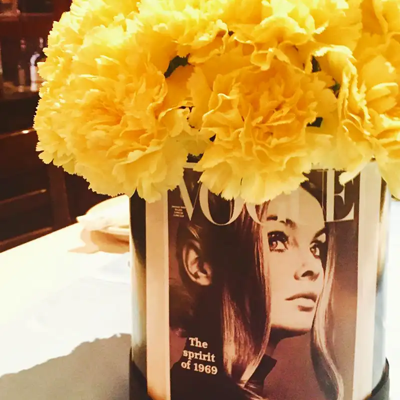 Yellow carnations in Vogue vase