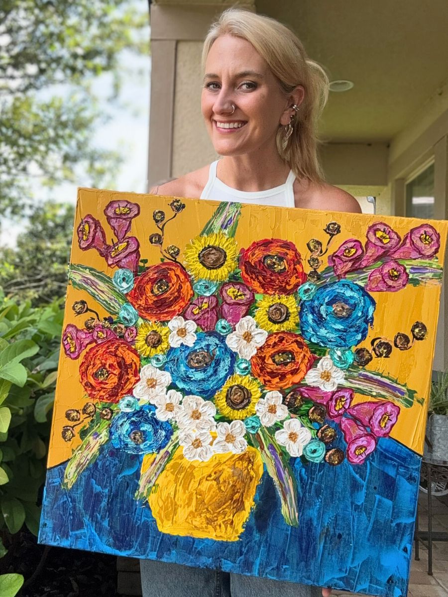 Florida artist Carolyn Veros with one of her art pieces
