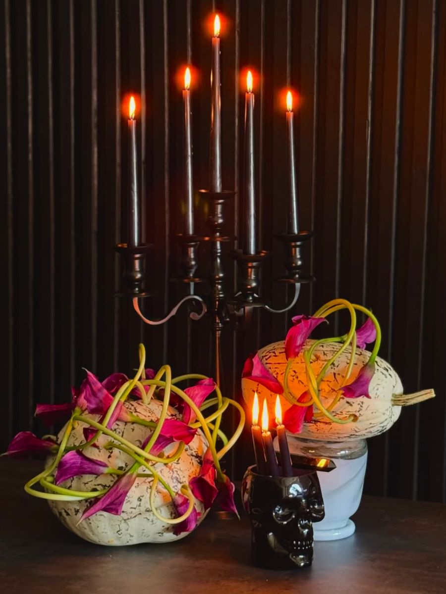 Halloween design with pink callas and candles Halloween design with pink callas and candles