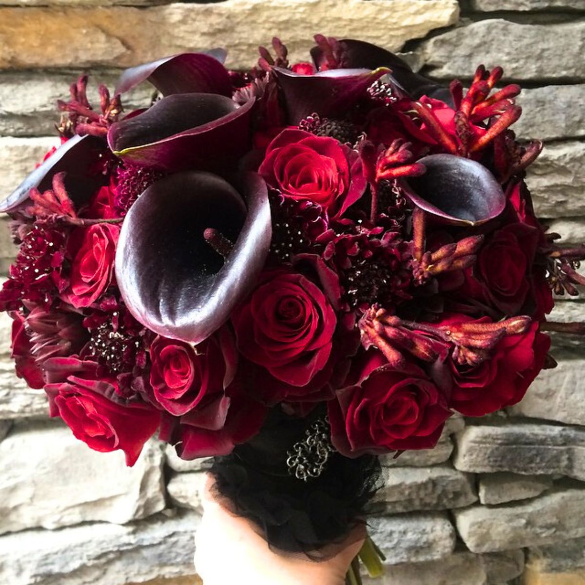 Hauntingly beautiful bouquet with callas and roses Hauntingly beautiful bouquet with callas and roses