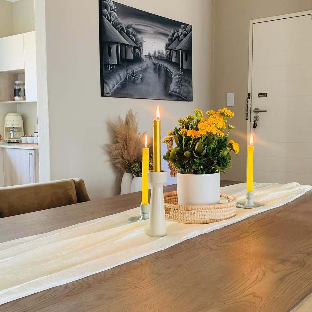 Dining table decor with yellow candles Dining table decor with yellow candles