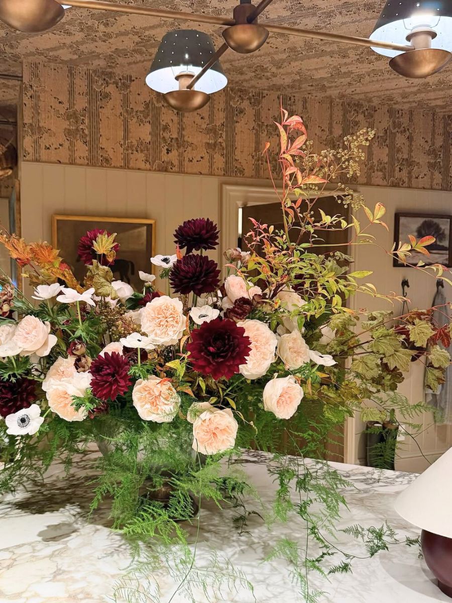 Asparagus ferns in a rose and dahlia arrangement Asparagus ferns in a rose and dahlia arrangement