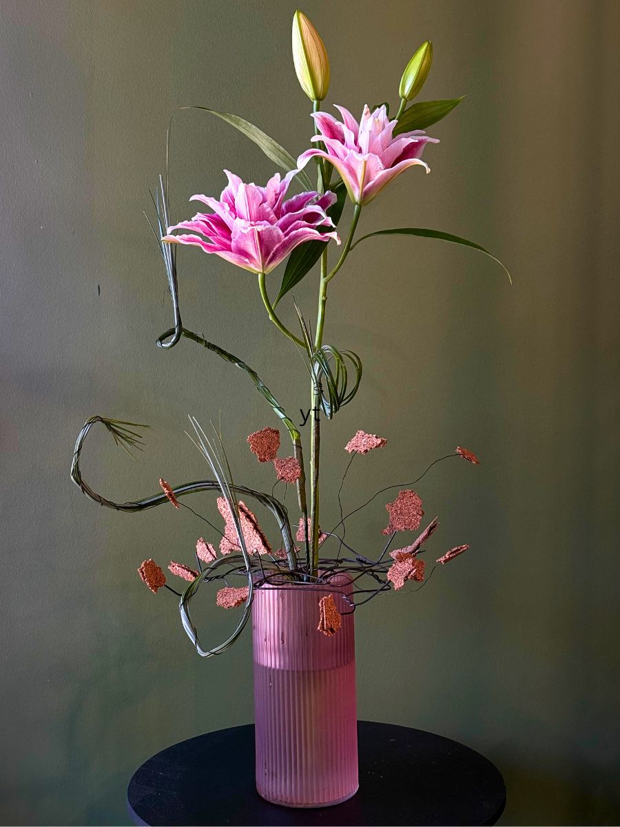 Bredefleur Friend Andrei Bindea With One Stem of Lilies