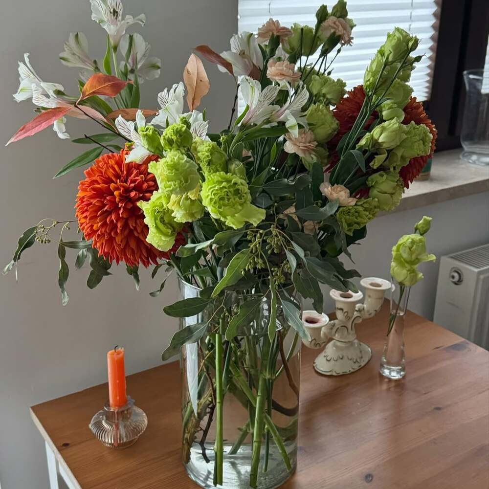 Vibrant autumn bouquet in glass vase Vibrant autumn bouquet in glass vase