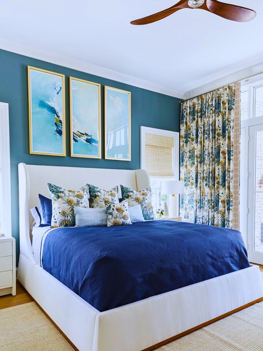 typical bright blue decor with sheets and floral curtain for your room