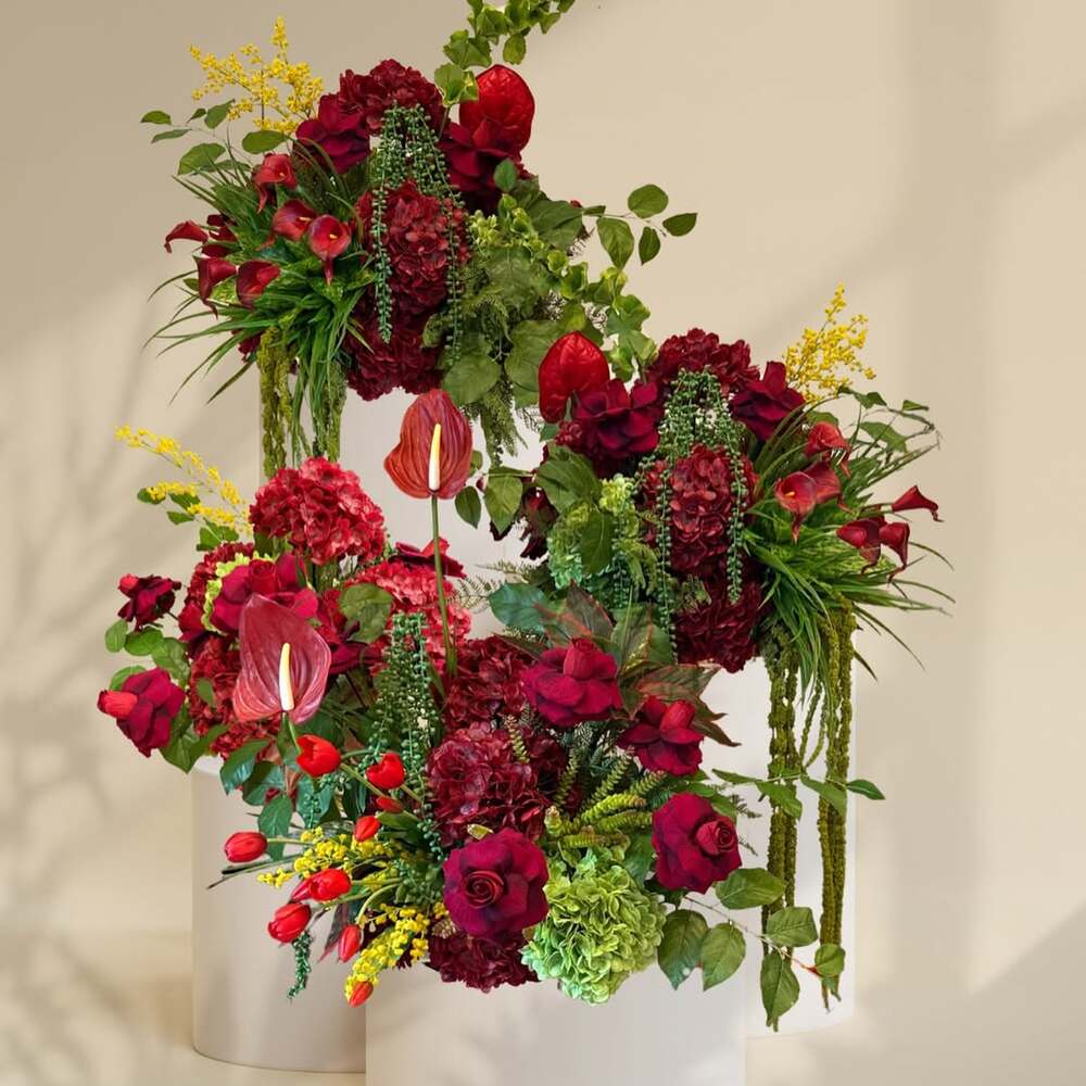 Luxury floral installation in red and green