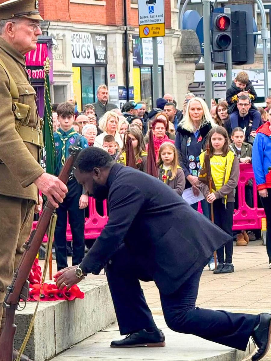 Placing red poppies for Remembrance Day