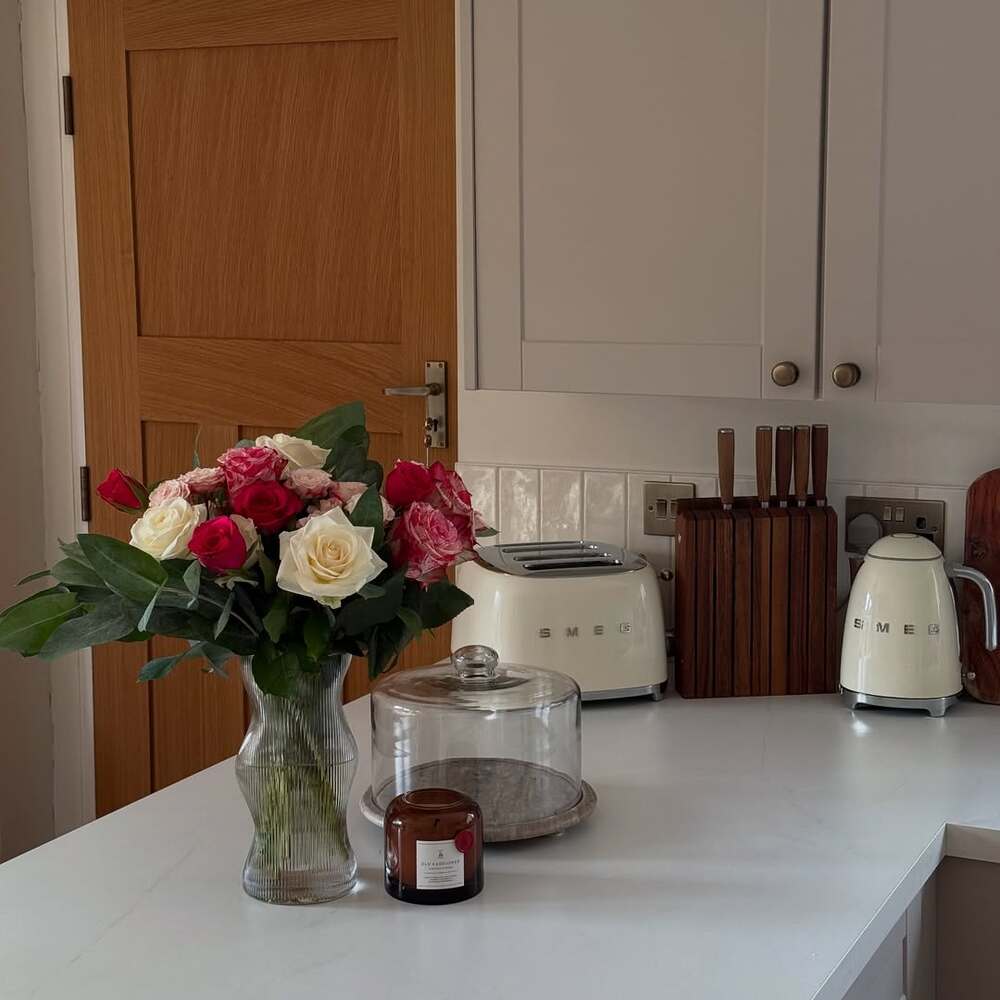 Fresh roses brighten a modern kitchen