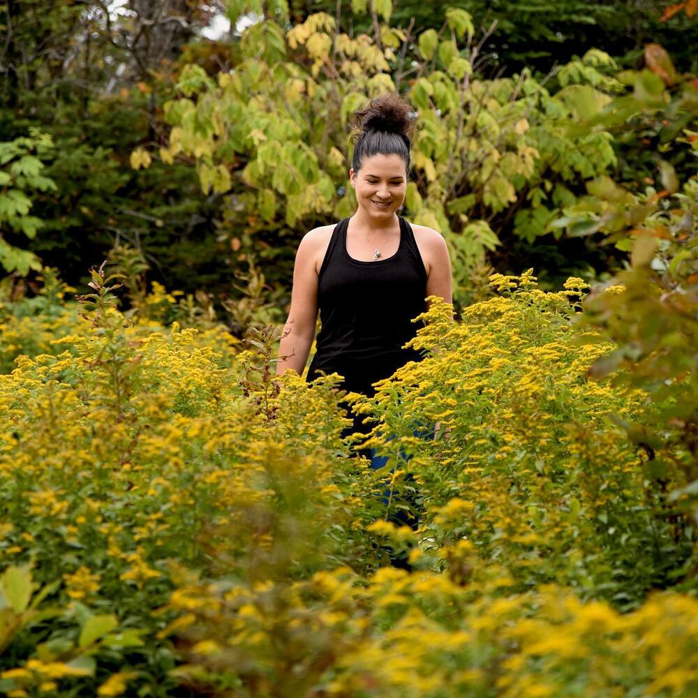 Lady walk near goldernod field