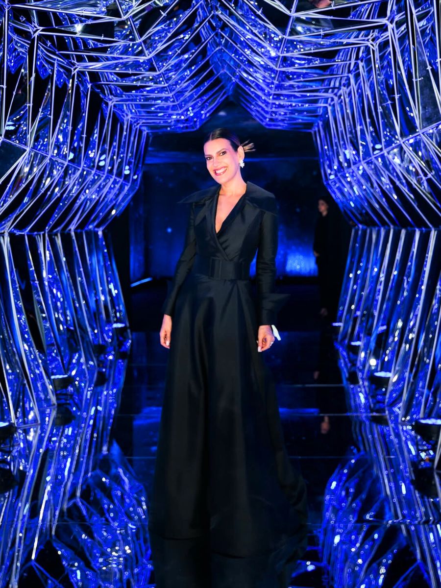 Andrea Guimaraes in a blue background