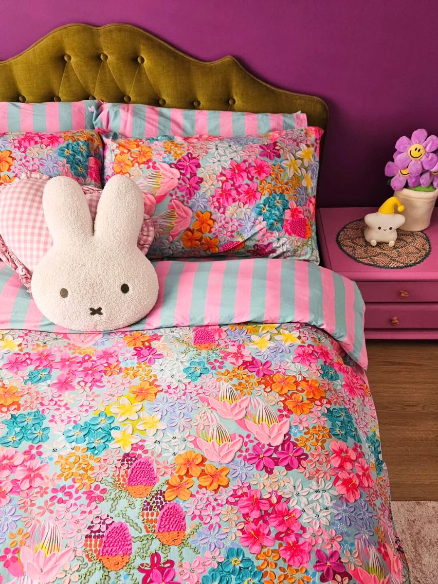 A bedroom filled with Alex Masons art