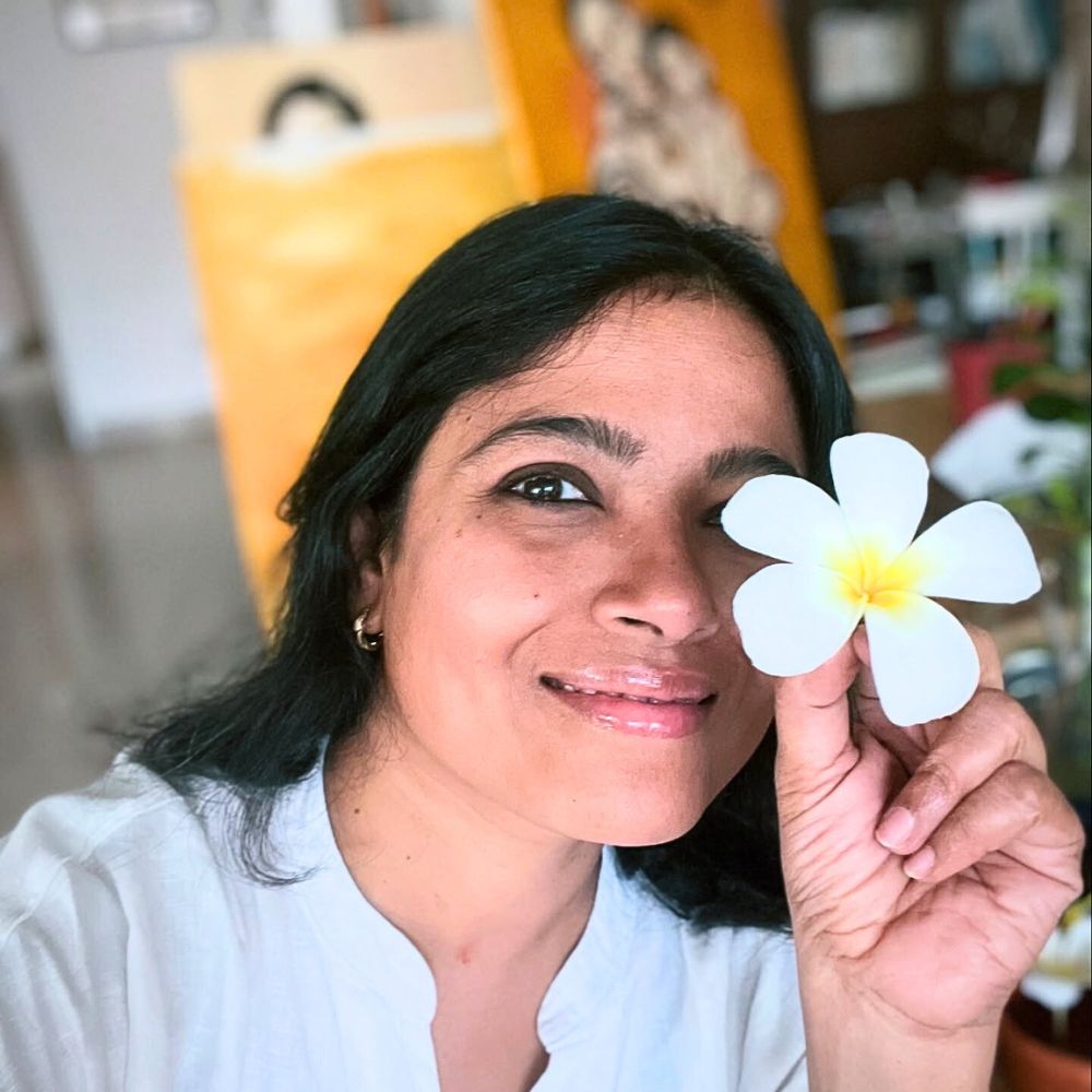 The joy of holding a plumeria flower